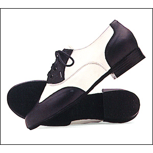 So-Danca Unisex Swing / Jazz Shoes Style #: JZ95. Designed in Cooperation with Father of American Jazz Dance, world famous Gus Giordano.<br>
Based on world renowned Giordano Spectator Jazz Tap.<br>
Soft, Flexible Leather Upper. Suede soles for smooth turns and supple comfort.
great looking stacked heel for longer leg line and quick moves.<br>
Lace through tongue for added security and comfort.<br>
Available in high steppin Black & White. Wide width available only up to size 11.