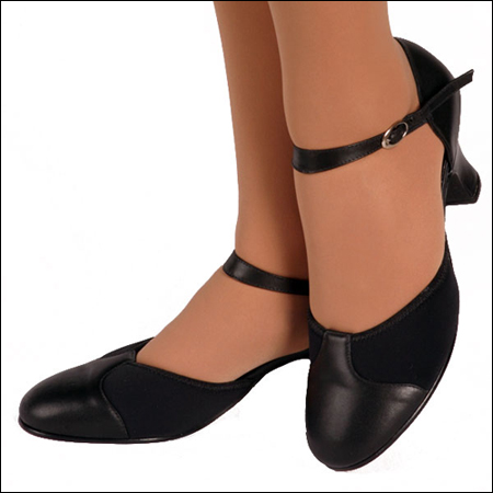 Capezio"New York" Soft Character Shoe Style #: 654/655. The New York is Capezio's newest and most technologically advanced character shoe. This unique leather and neoprene upper combines the stretch and comfort of your favorite jazz shoe with the classic look and feel of a character shoe. The 2inches flared heel creates a great look and provides a larger strike zone, finished with a leather and micro sole.
