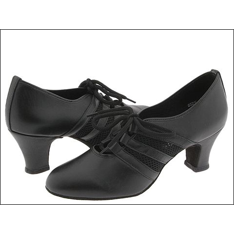 "Verona" By Freed Of London Style #: Verona. Ladies lace-up practice shoe with 3 eyelets, no tongue and mesh inserts for comfort.  Originally designed for professional teachers on their feet for many hours a day. Mesh inserts provide ventilation, heat dispersion and added flexibility. Made on the same last as the Milano practice shoe.  Designed in association with international coach, Karen Hardy.

Leather upper with mesh inserts. Suede sole. U.S Sizes 4 to 11.5 in half sizes. Medium width available in Tan or Black. Wide in Black only. 2” shaped Cuban heel. Special orders of alternative material available with a minimum order of 10 pair.
Wide width available in Black only.